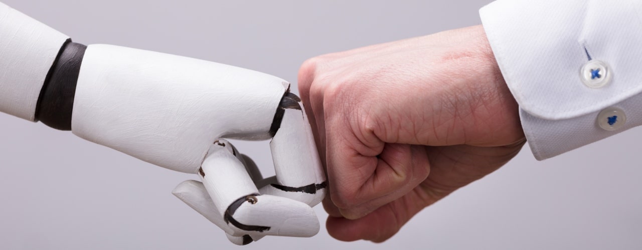 Human and a robot fist bump